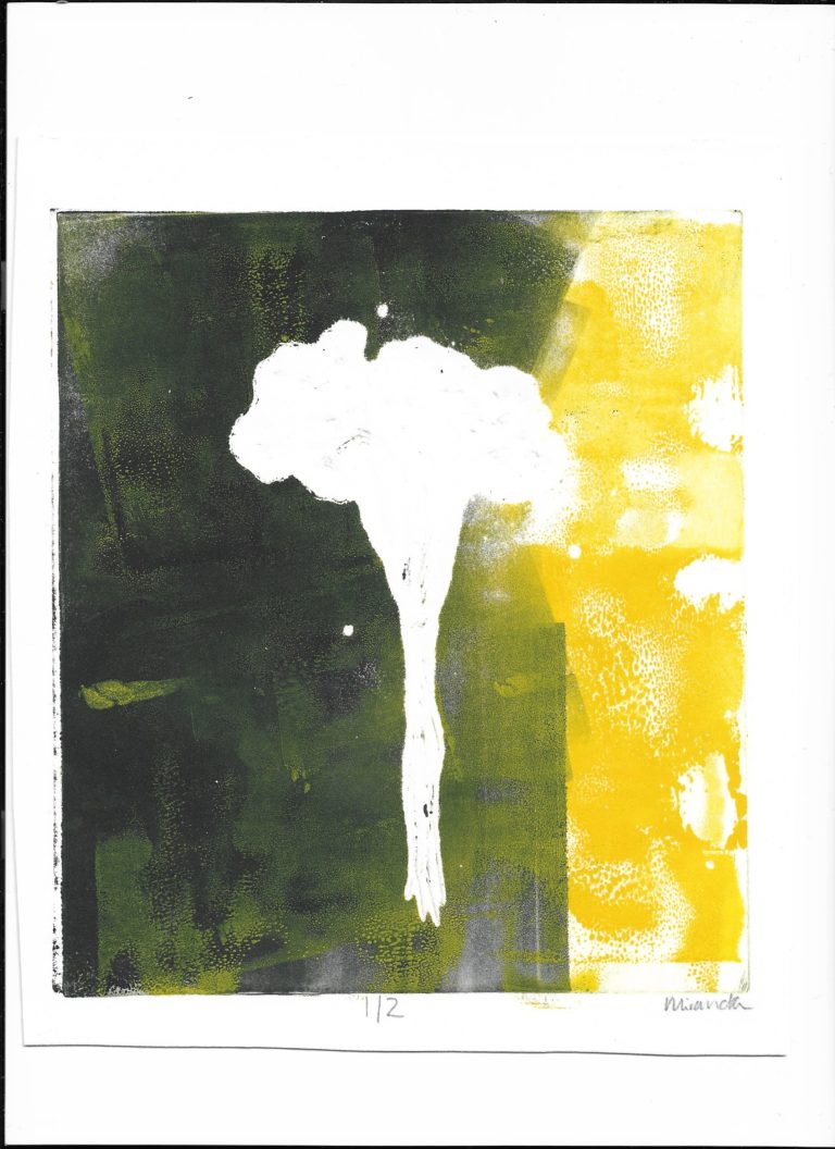 Image of a white atomic like explosion with black and yellow of either side.
