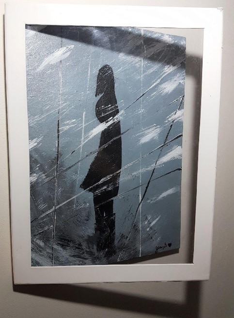 Silhouette of a woman in a winter storm