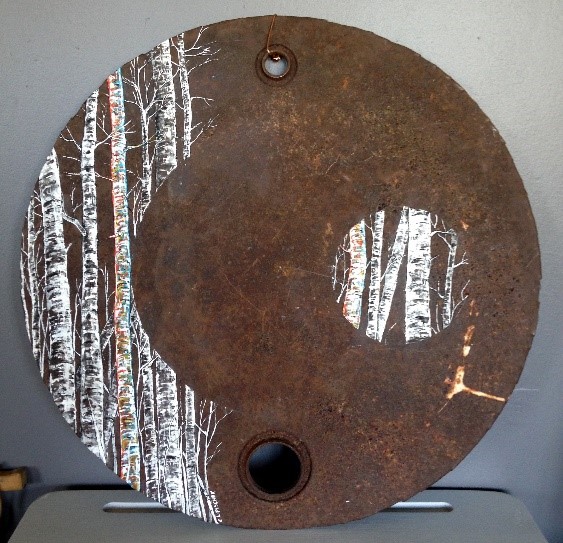 a rusty oil drum lid with a painting of birch trees on it